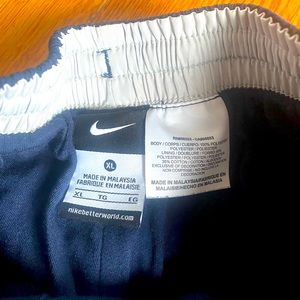 Navy blue and white sweatpants in good condition.